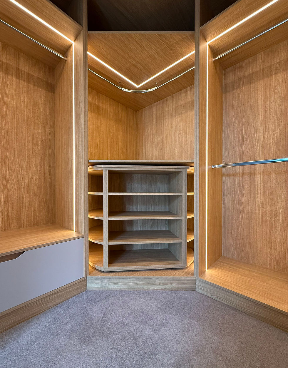 Rotating show storage in wardrobe corner with oak lined interior