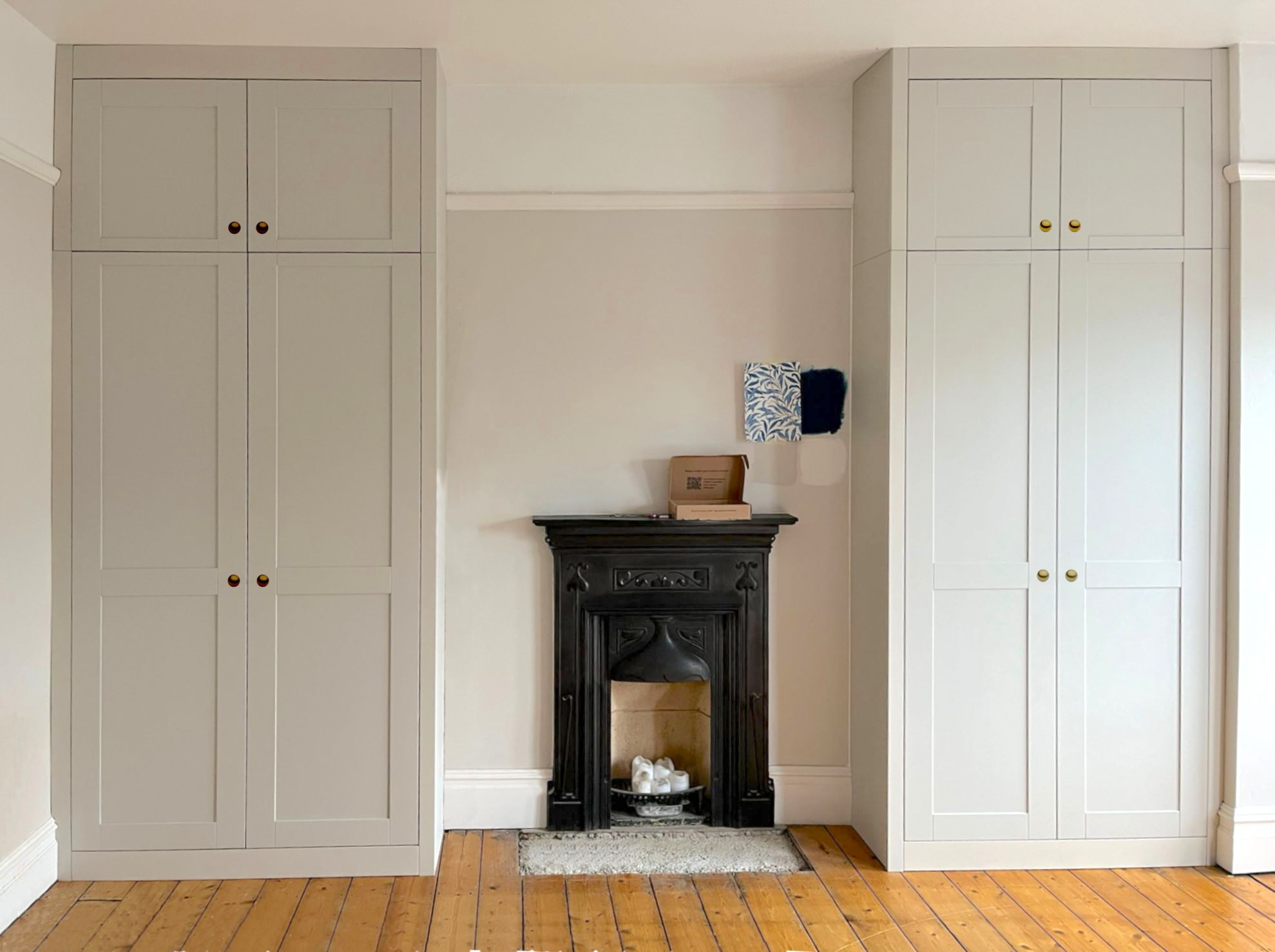 Alcove fitted wardrobes painted in putty colour in Sussex