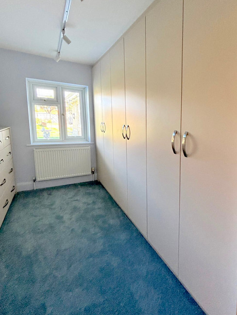 fitted white wardrobes with chrome handles in middleton-on-sea