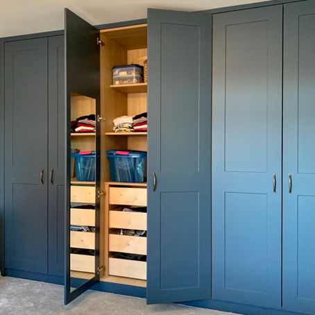 Shaker style built-in wardrobes dark blue
