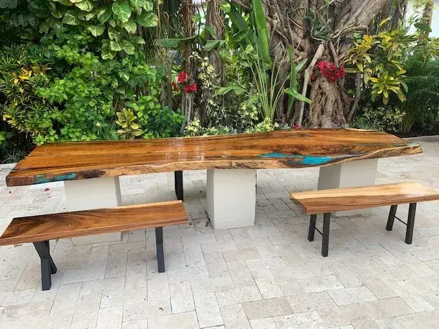 teak table with bright blue epoxy