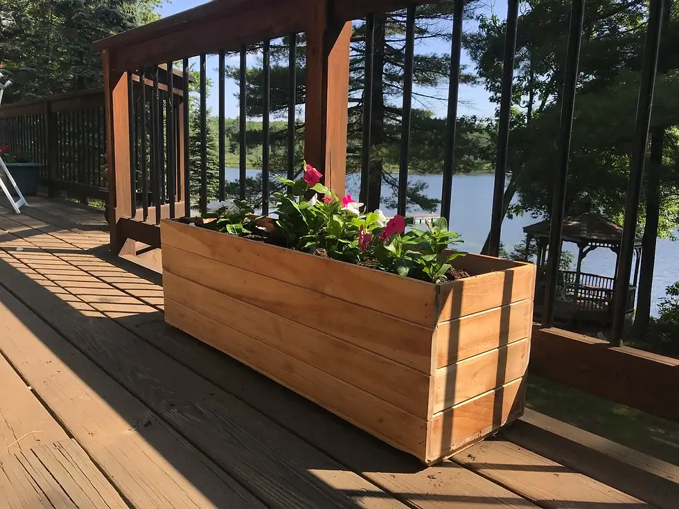 teak planter box  with pretty flowers 