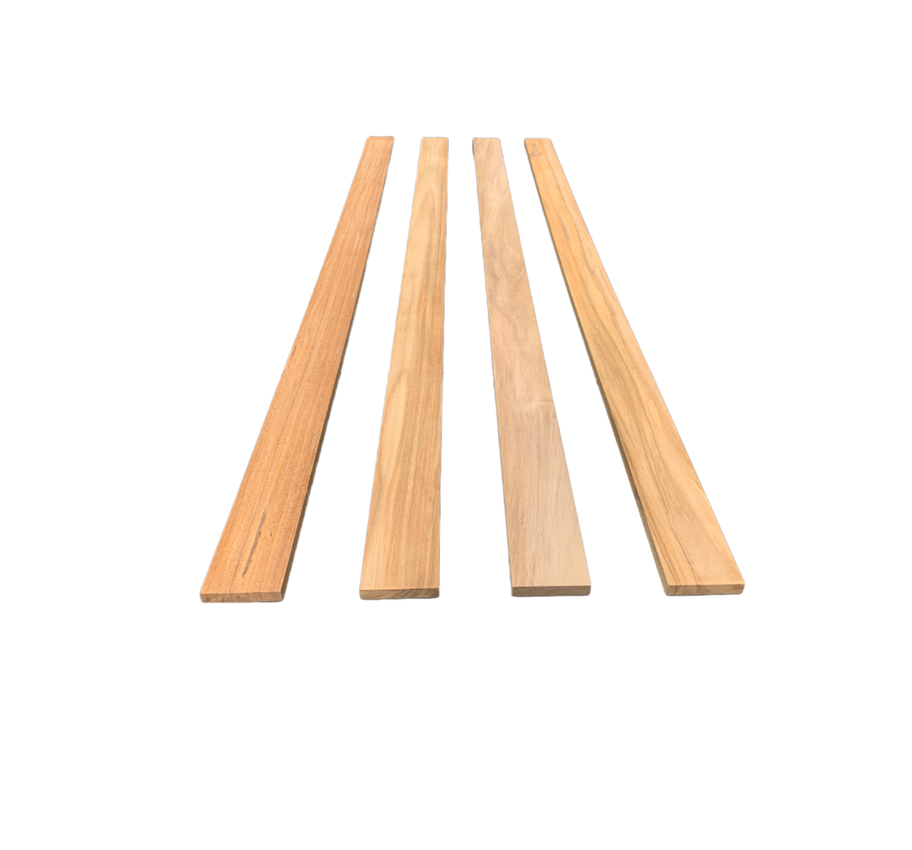 Four wooden planks on a dark background showing different wood grains. Diamond Tropical Hardwoods
