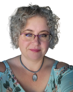 Portrait of an adult with short curly gray hair, glasses, and a patterned top, smiling against a light blue background.