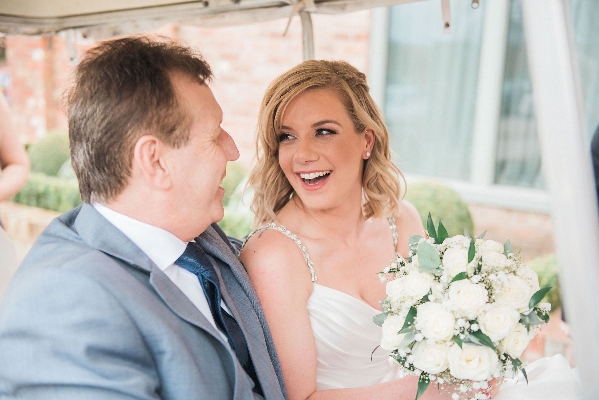 Bride and bouquet before the wedding with the father of the bride. Leicestershire wedding photographer.