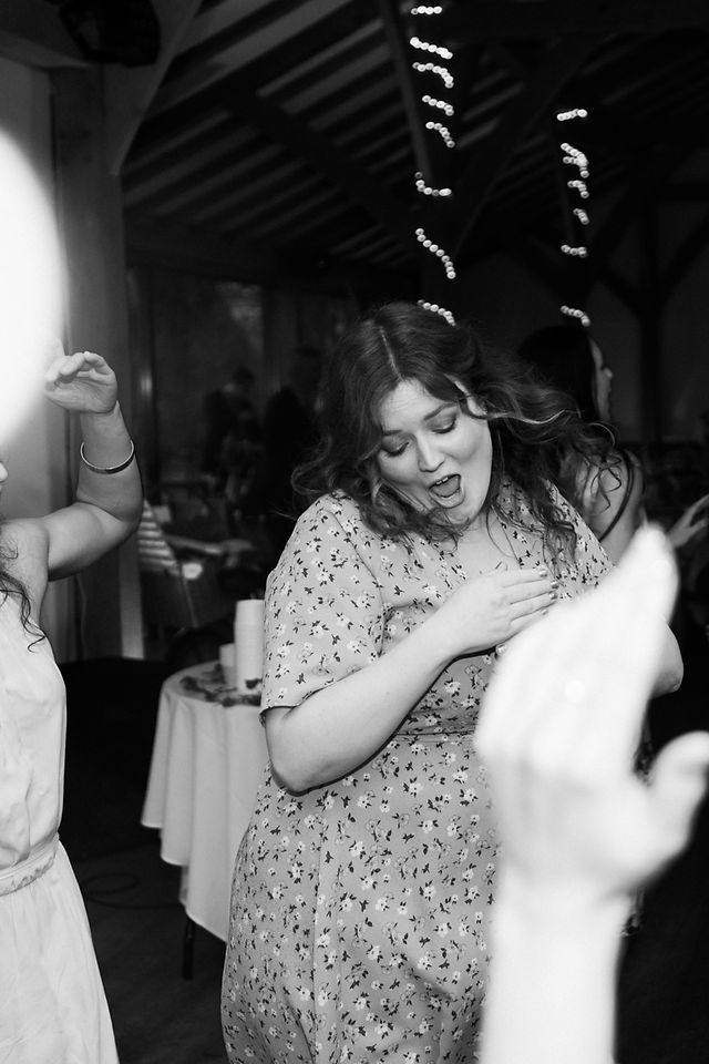 Wedding guests having a dance on the dancefloor. Professional wedding photography, this time in black and white. East Midlands Wedding Photography. Covering wedding photography in Rutland, Warwickshire, Derbyshire, Northamptonshire, Lincolnshire, Darley and Underwood Photography.