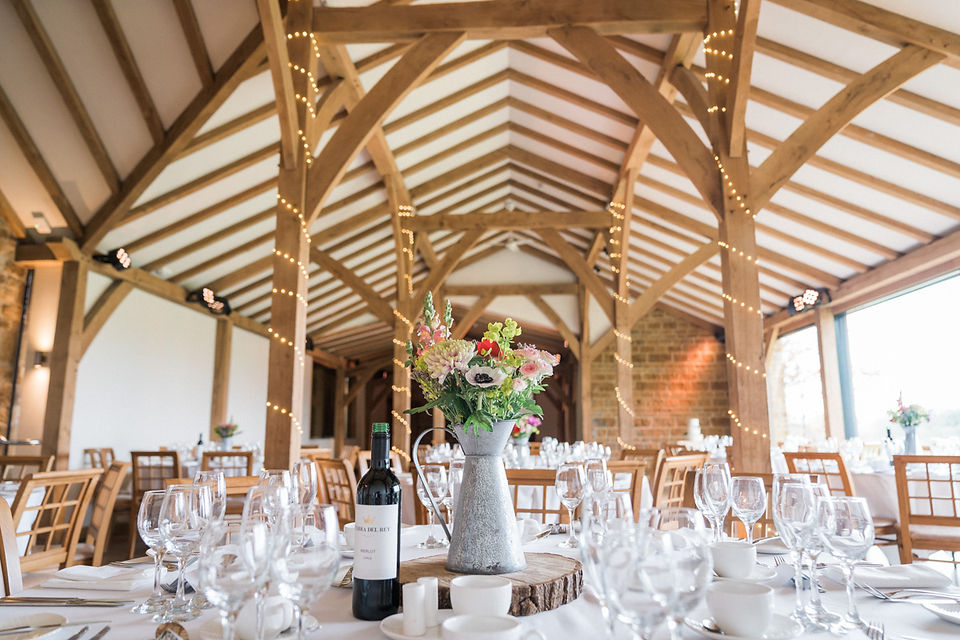 Beautiful wedding photography at Dodford Manor wedding venue. Dining room set up with oak beams and table decorations. Documentary wedding photography. East Midlands Wedding Photography. Covering wedding photography in Rutland, Derbyshire, Lincolnshire, Darley and Underwood Photography.