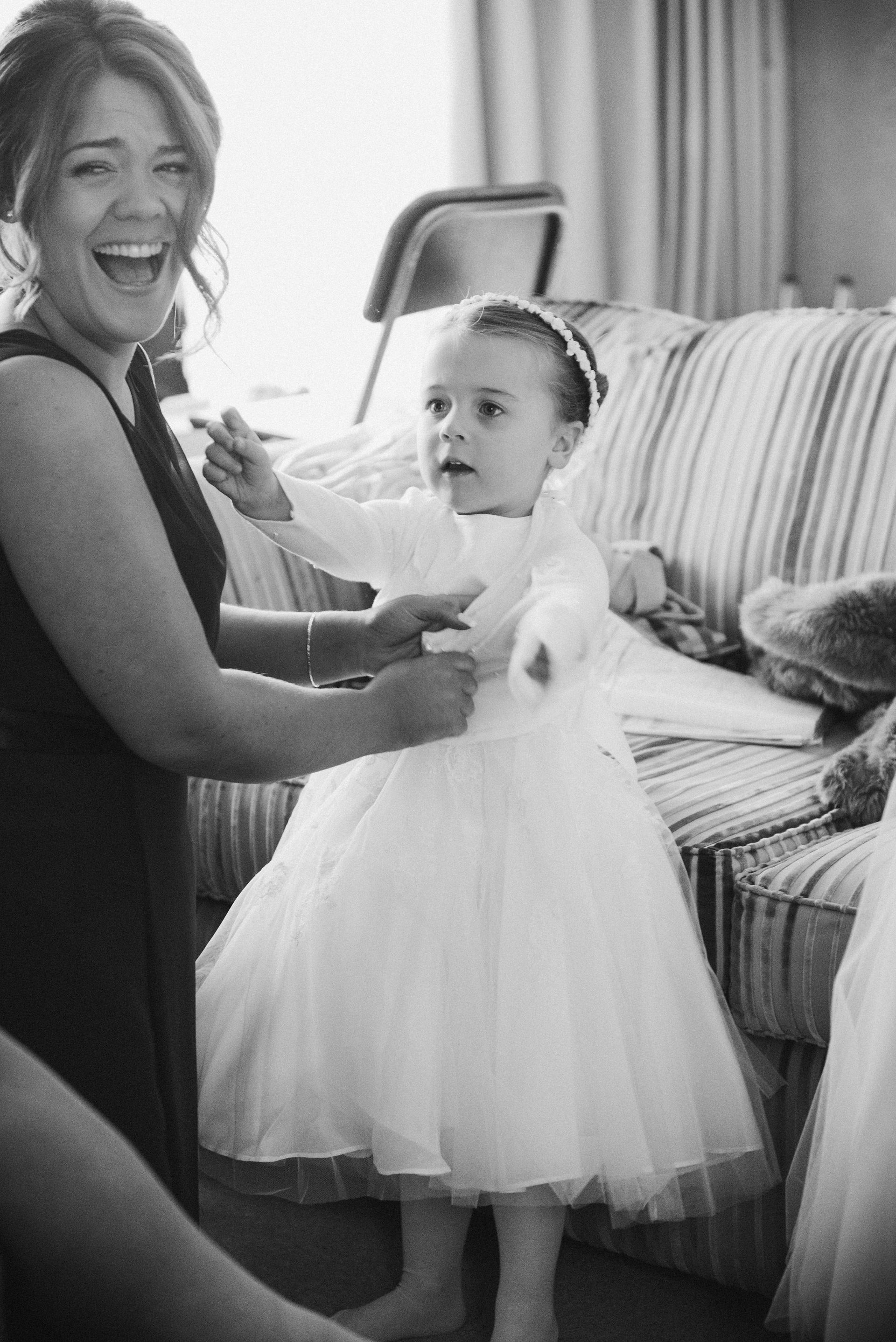 Documentary wedding photography Nottinghamshire. Flower girl preparations.