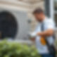 an hvac service repair man working on an air conditioning unit outside of a house he is we