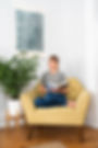 TJ in chair reading.JPG