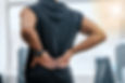 Gym, injury and man with hand on back pain for medical emergency from workout at sports st