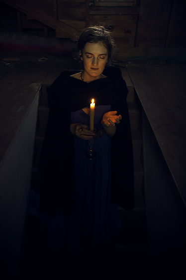 Jestira with a candle.