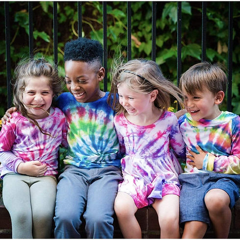 children with tie dyed shirts.jpeg