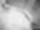 Abstract image used as a background graphic in a break section before the footer; contains earth-like texture, grayscale