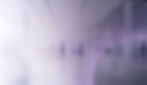 Banner section bacgkround image, with inspirational elements including silhouettes of people walking on the distance in a business building and an overaly of purple abstract elements