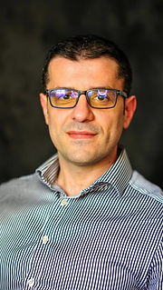 Enis Elezi - Professional Profile Photo, Owner / Co-Founder at PeoplePath Consultancy - a portrait photo with a formal tone - image part of the website's about/team section