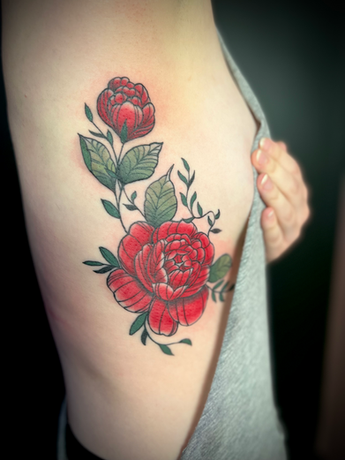 Peony rib Tattoo by Stephanie Prescott-Flynn at Atomic Tattoo and Piercing.