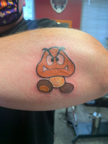 Goomba Mario Tattoo by Stephanie Prescott-Flynn at Atomic Tattoo and Piercing.