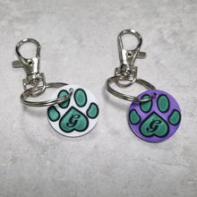 3D-geprint winkelwagenmuntje met sleutelhanger in verschillende kleuren.