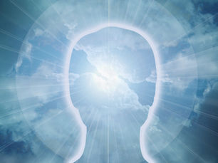 An outline of a person's head against a blue sky