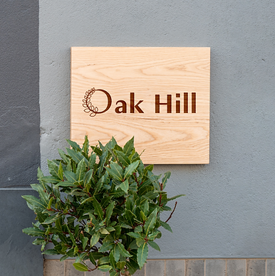 Wood Sign on Wall PSD Mockup.png