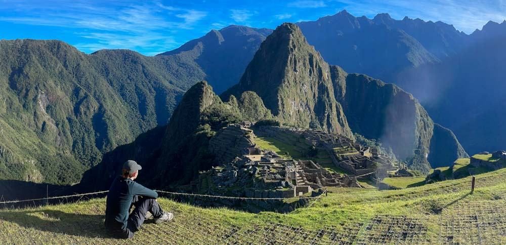 Man looking over Machu Picchu