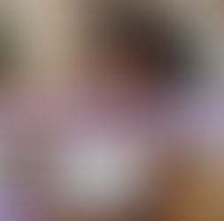 a photorealistic image of a beautiful African American woman holding an amethyst healing crystal to her forehead while lying comfortably on a couch in her modern yet Afrocentric living room; Lightworkers Garden
