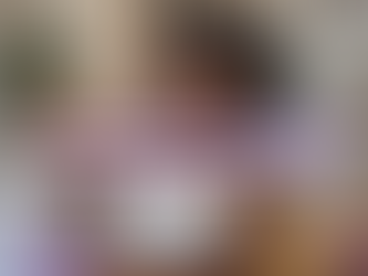 a photorealistic image of a beautiful African American woman holding an amethyst healing crystal to her forehead while lying comfortably on a couch in her modern yet Afrocentric living room; Lightworkers Garden