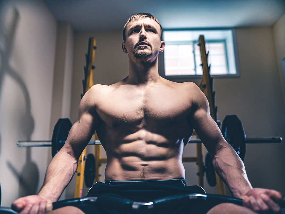 Fit man doing bicep curls