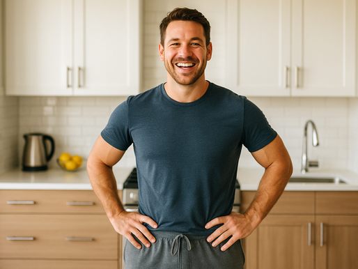 Smiling man standing in his kitchen