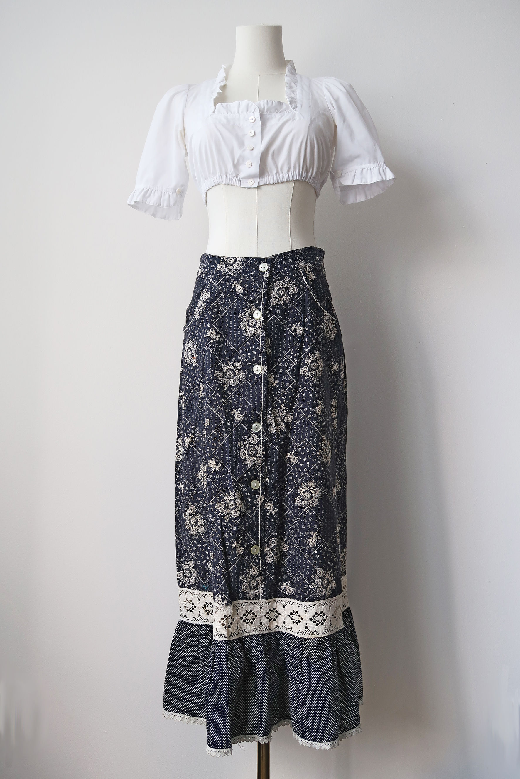 Vintage 70's milkmaid floral tiered skirt in navy with lace details. UK 10.