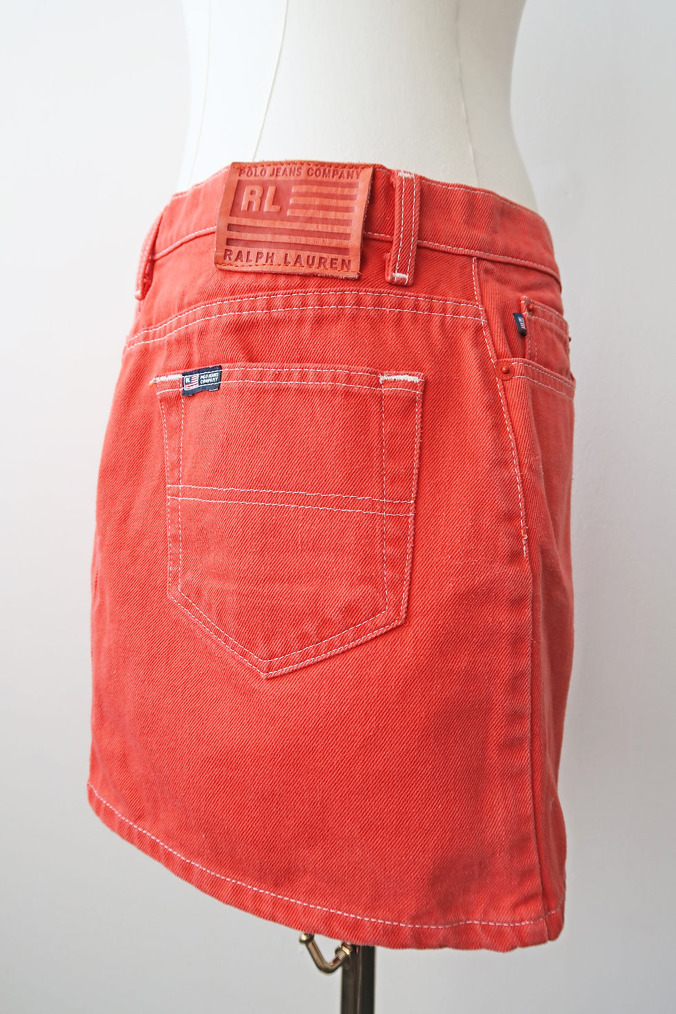 Thumbnail: Vintage 90's 'Polo Jeans Co' denim mini skirt in orange. Size UK 10.