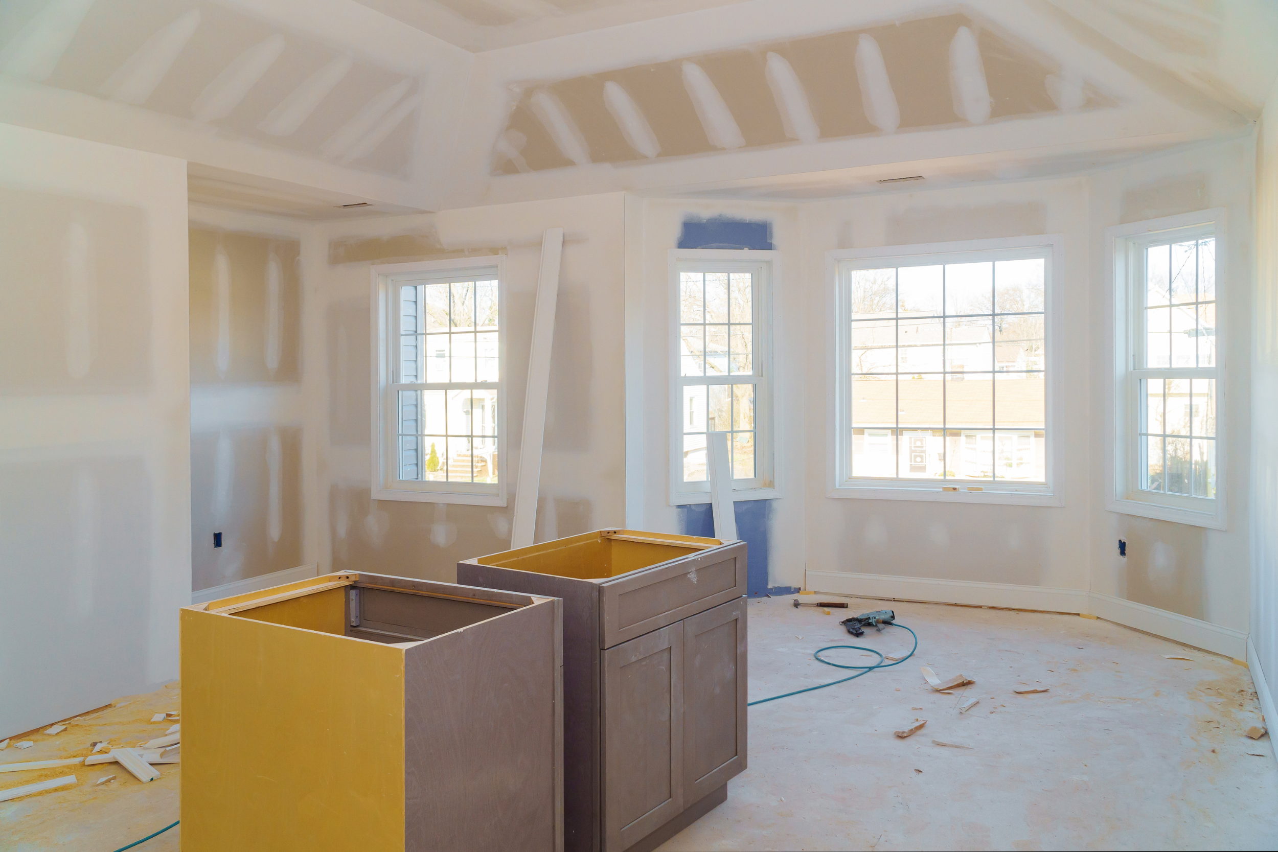 A modern kitchen renovated by Herlin Renovations with new countertops, cabinets, and appliances.