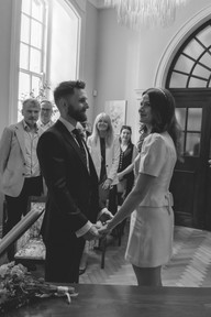 bride and groom hold hands during their ceremony