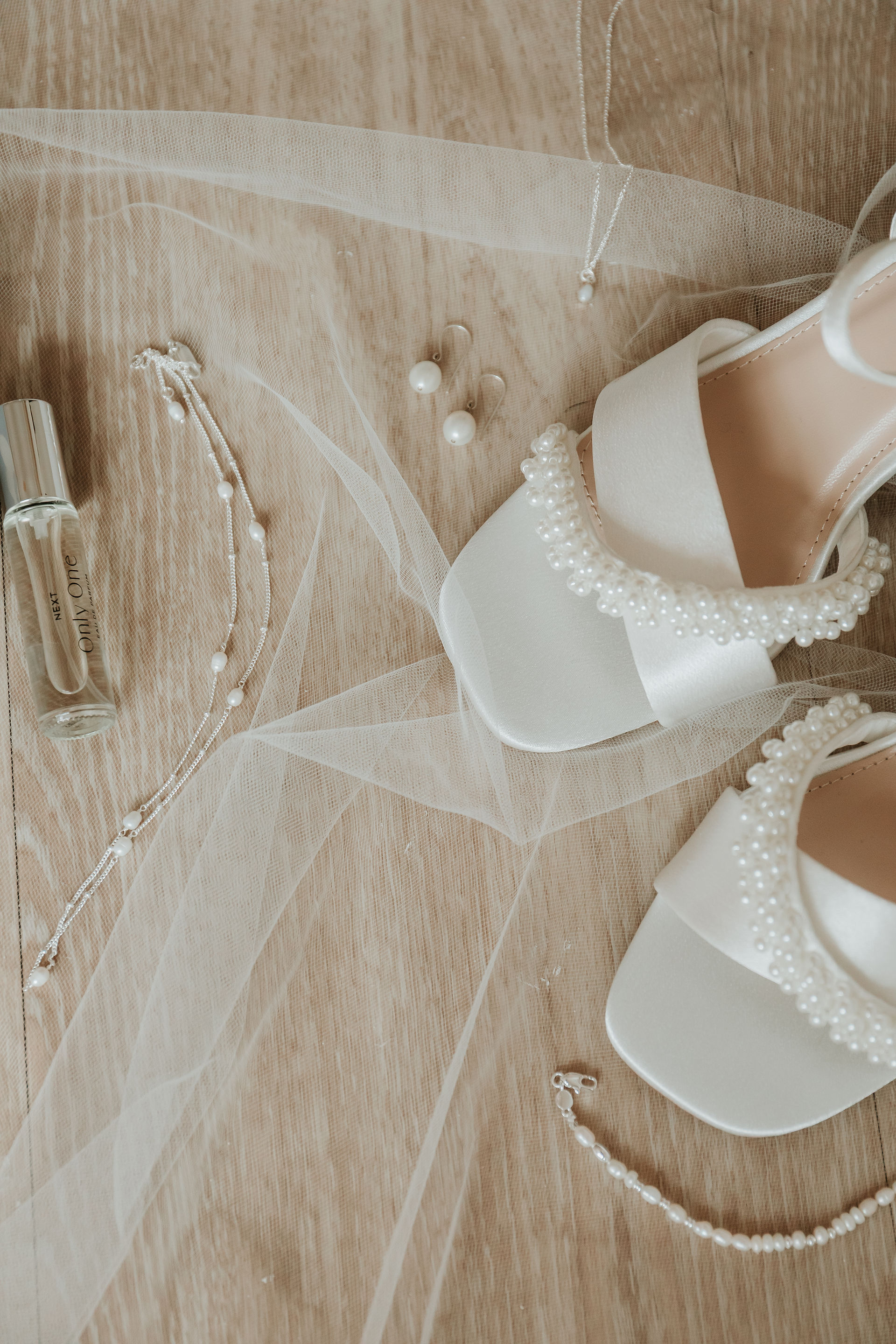 details of the brides items for her wedding day set as flat lay