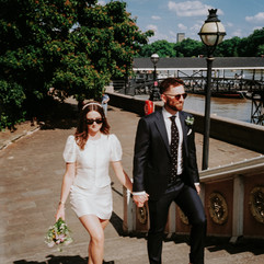 35mm film bride and groom walk up the stairs of Albert Bridge