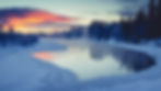 snow, trees and a small body of water in Alaska