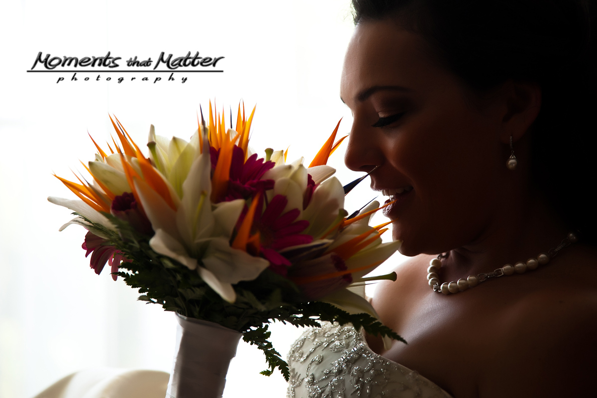 Bride holding a tropical bouquet at Grand Sirenis Riviera Maya