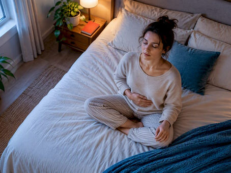Person practising calming breathing in bedroom