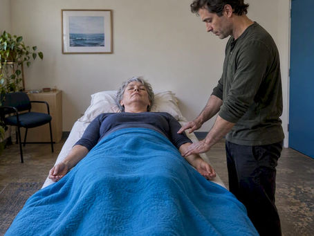 Participant receiving Reiki in a research room