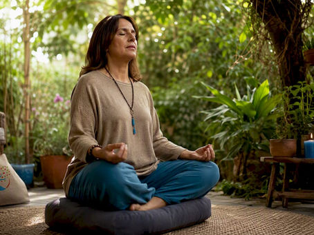 Woman meditating for root chakra grounding indoors