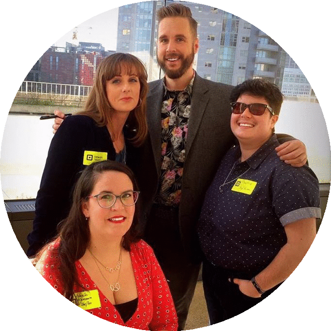 An image of two white women, a white man, and a Latinx man.
