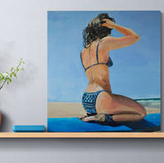 Realistic beach painting of a woman in a blue patterned bikini kneeling on a surfboard, set against a sunny ocean backdrop.