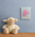 A still‑life painting of bright pink slide sandals resting on a soft blue‑grey surface, shown with gentle shadows, pastel ton