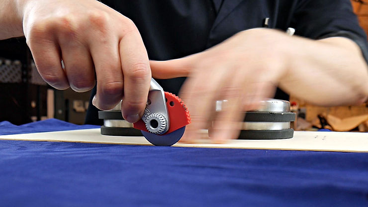 Cutting out a pocket lining in blue suede