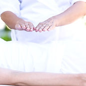 Calm woman receiving reiki treatment in the health spa_edited.jpg