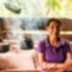 Woman standing in a modest Guatemalan kitchen — a glimpse of the daily reality mission teams are called to serve