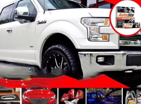 White truck with tire and logo, Autolast Ghana, automotive parts display.