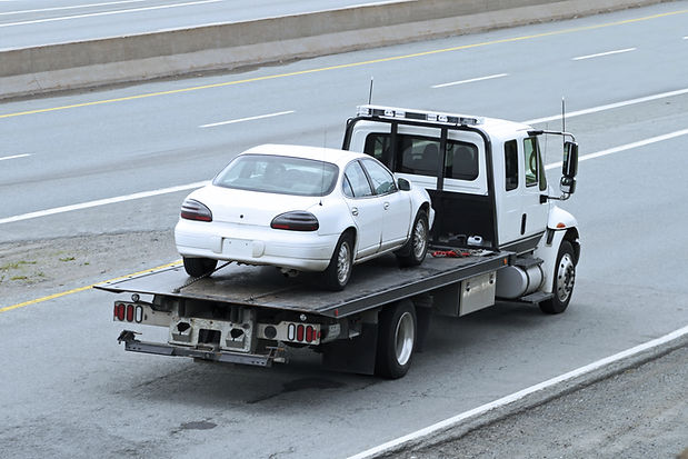 Towed White Sedan