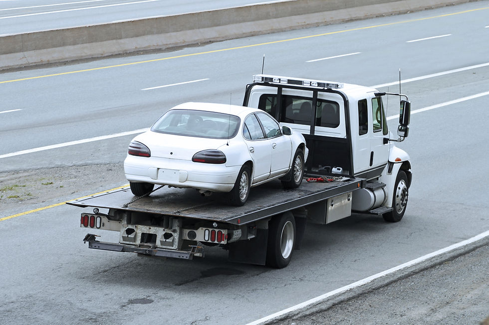 Towed White Sedan